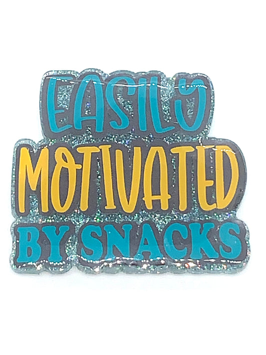 "Easily motivated by snacks" badge reel topper